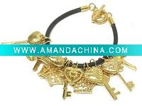 Wholesale Multi key and crown charm rubber band toggle bracelet
