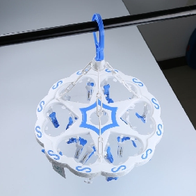 Wholesale White Plastic Sock Hanger with  Blue and White Clips Interspersed with Blue Patterns