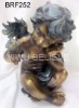 resin figure of angel playing with bird