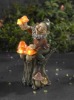 garden gnome figurine with lighted mushroom